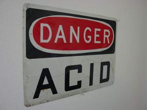 A sign that says Danger Acid