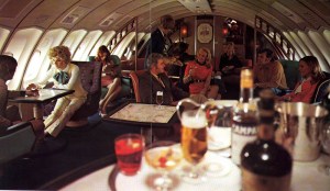 People in business class on a Qantas plane in the 70s.