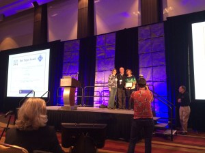 Claudia Szabo holding plaque - like a BOSS!